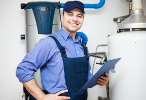Technician servicing heating and cooling system