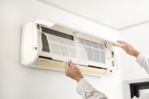 air conditioning unit being repaired