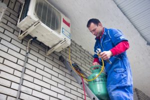 man performing an air conditioning repair