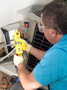man performing air conditioning repair